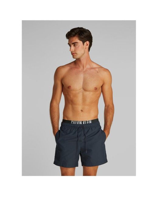Maillots de bain KM0KM01093 Calvin Klein pour homme en coloris Blue