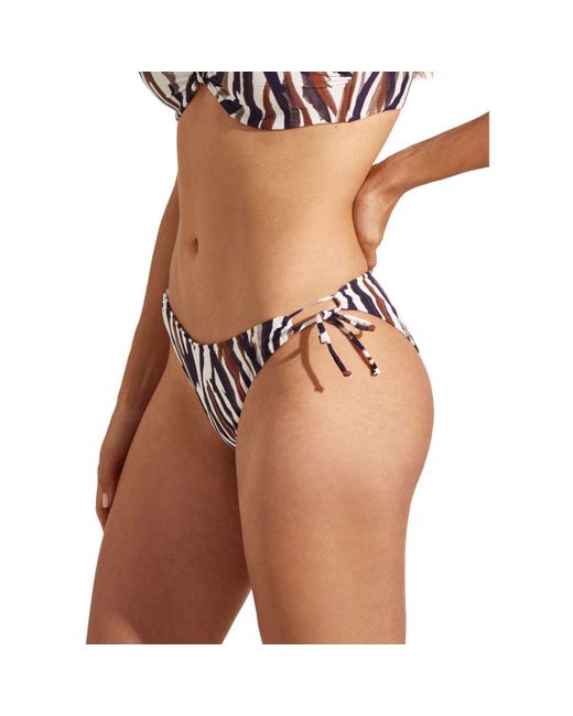 Maillots de bain Bas maillot slip de bain bikini taille basse à nouettes Selmark en coloris White