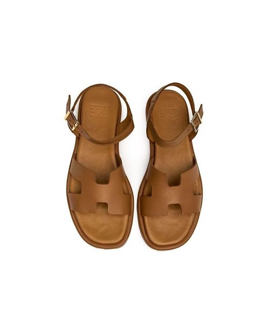 Sandales plates Norma Des Sandales Sole en coloris Brown