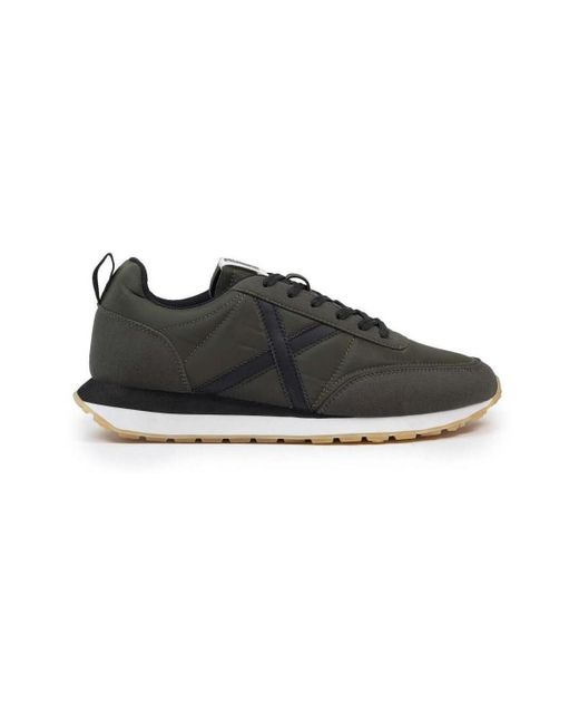 Baskets basses Munich pour homme en coloris Black
