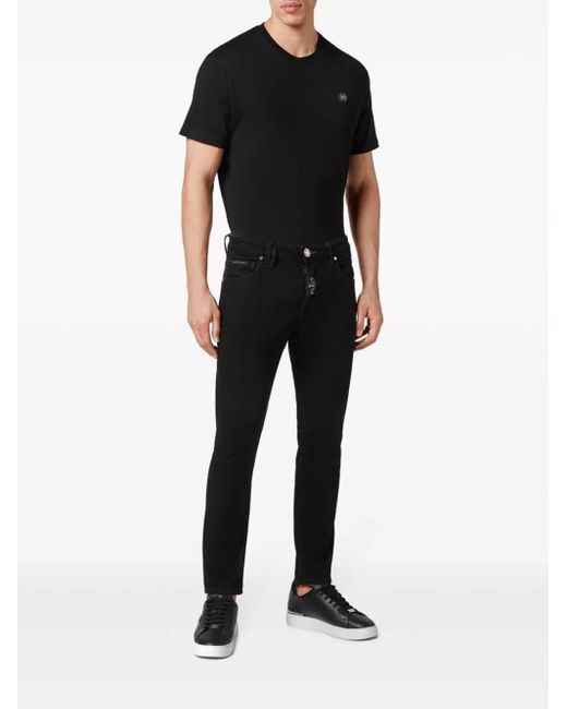 Jeans skinny con applicazione di Philipp Plein in Black da Uomo