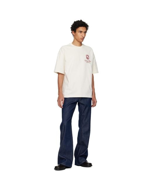 Amiri Blue Raw Boot Cut Jeans for men
