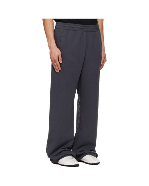 we11done Blue Multi-Logo Sweatpants for men