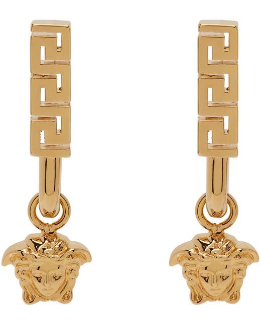 Boucles d'oreilles dorées à méduse Versace en coloris Metallic