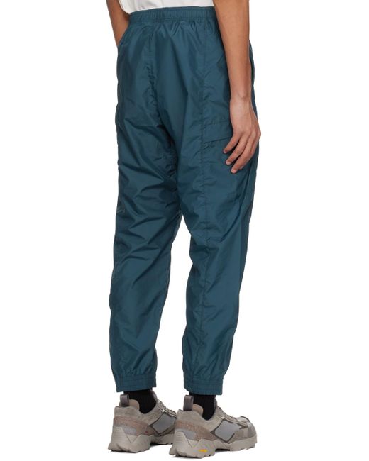 Win pantalon de randonnée indigo en tissu antidéchirures léger Goldwin pour homme en coloris Blue