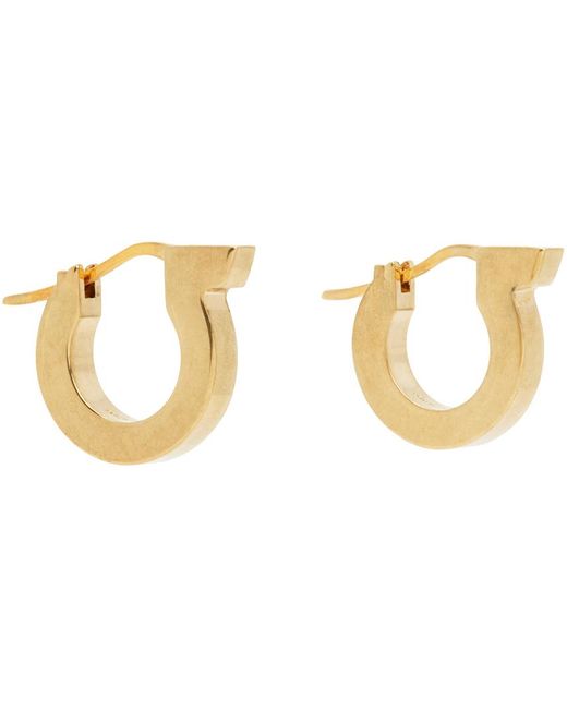 Boucles d'oreilles à anneau dorées en laiton Ferragamo en coloris Black