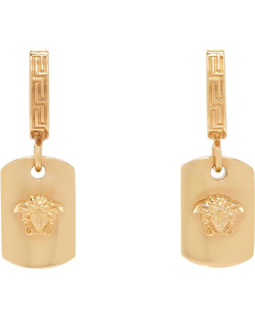 Boucles d'oreilles à anneau dorées à méduse Versace en coloris White