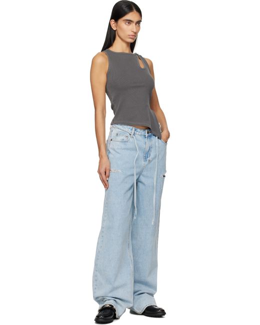 Jean Ample Rollin Bleu À Découpes Ksubi en coloris Blue