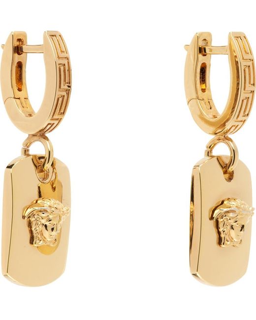 Boucles d'oreilles à anneau dorées à méduse Versace en coloris White