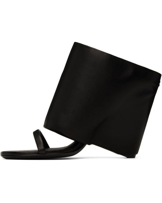 Courreges Oblique Wedged Leather Mules in Black | Lyst