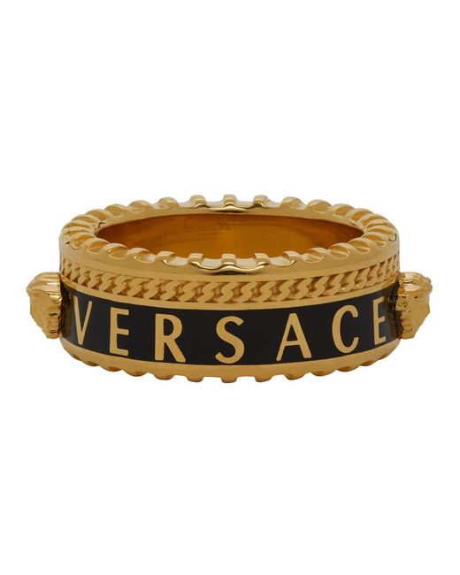 Versace Metallic Gold And Black Logo Band Ring for men