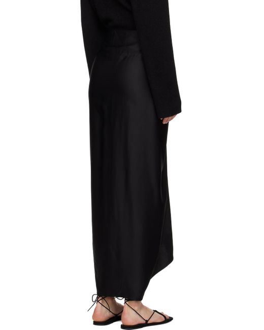 Jupe longue noire à ornement noué Totême  en coloris Black