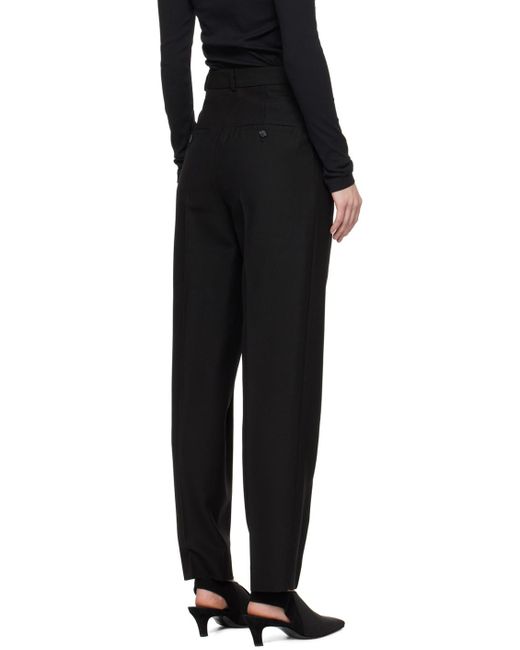 Pantalon noir à plis Totême  en coloris Black