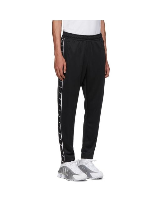 Nike Black Swoosh Tape Track Pants in Black for Men - Lyst