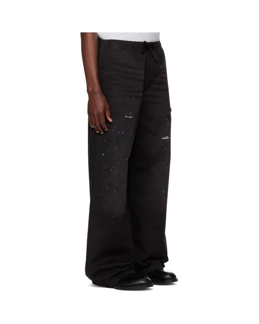Acne Black Paint Splatter Drawstring Trousers for men
