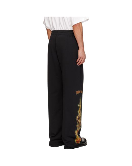 we11done Black Fire Sweatpants for men