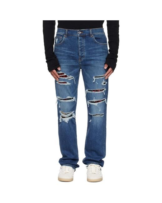 Amiri Blue Floral Velvet Slim Thrasher Jeans for men
