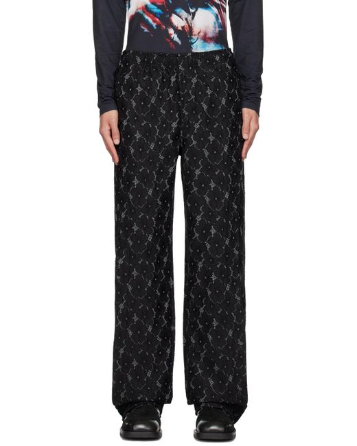 ANDERSSON BELL Black Flower Trousers for men
