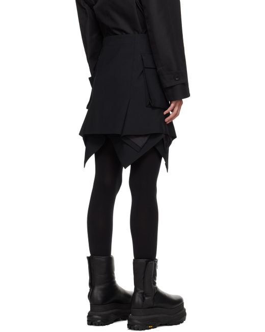 Mini-jupe noire à basque Sacai en coloris Black