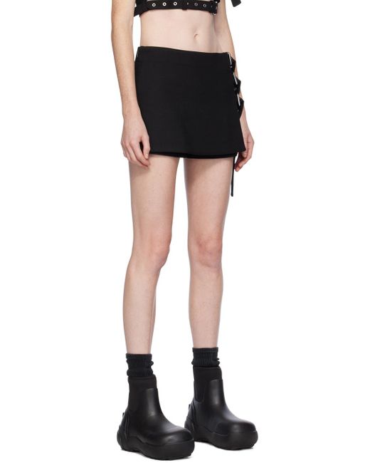 Mini jupe-short noire à boucles Ambush en coloris Black