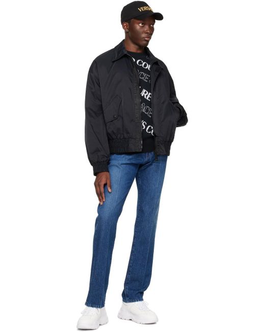 Pull noir à motif à logo Versace pour homme en coloris Black