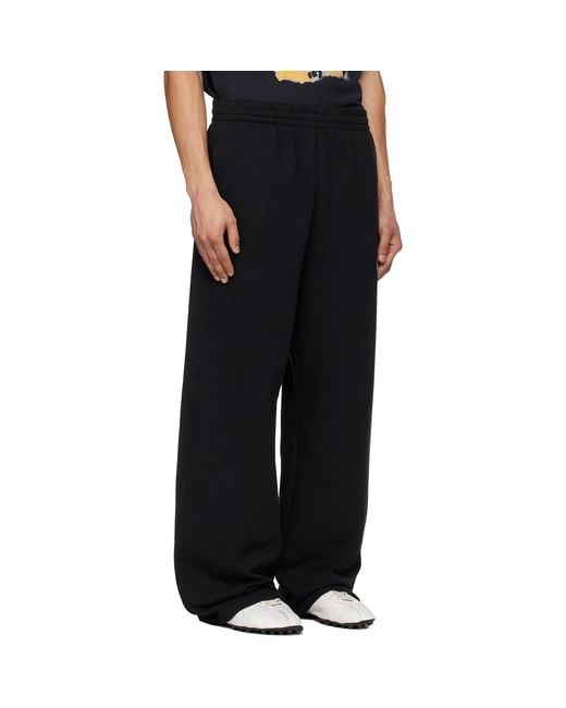 we11done Black Curved Sweatpants for men