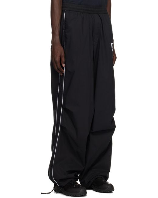 メンズ Rhude ブラック パイピング パラシュート トラックパンツ Black