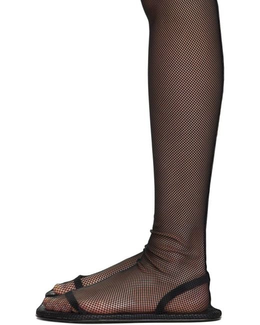 The Row Flat Sock Boots in Brown Lyst