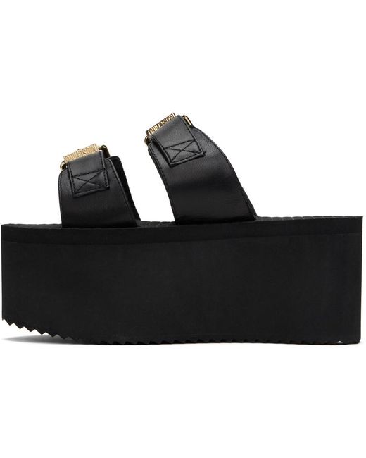 Sandales compensées noires à boucles à logo Moschino en coloris Black