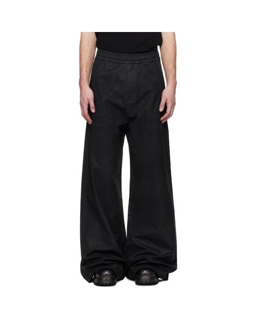 Det Blev Sent Black Waxed Elastic Trousers for men