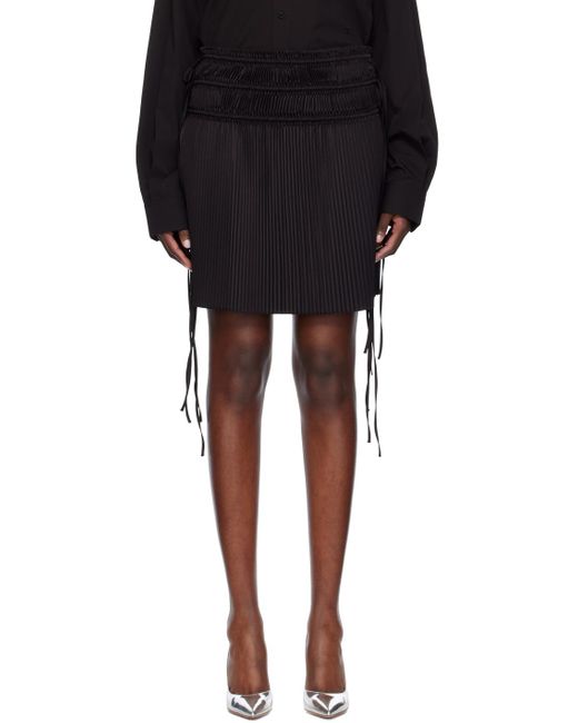 Mini-jupe noire à plis Helmut Lang en coloris Black