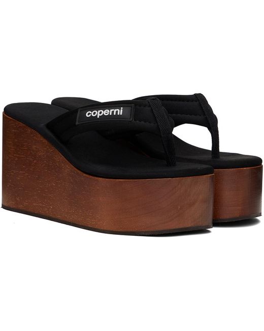 Sandales à talon compensé en bois noires à écusson à logo Coperni en coloris Black