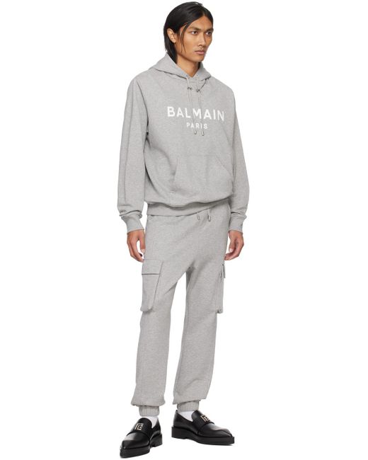 Pull à capuche gris à logo imprimé Balmain pour homme en coloris Gray