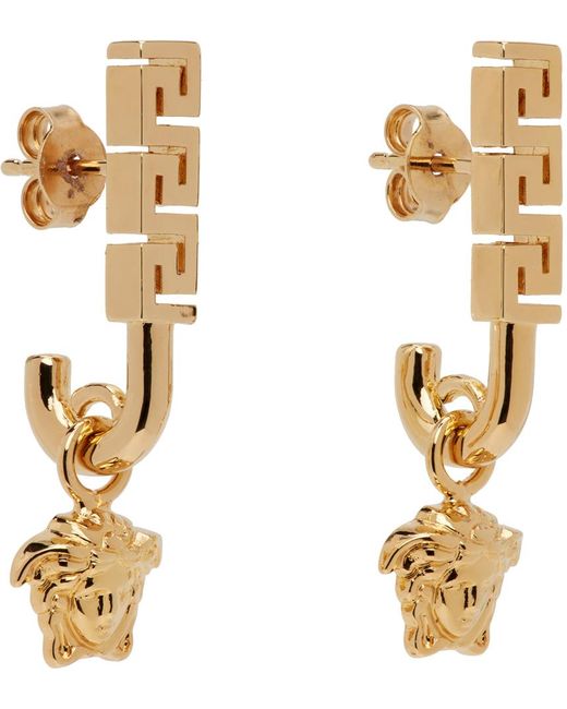 Boucles d'oreilles dorées à méduse Versace en coloris Metallic