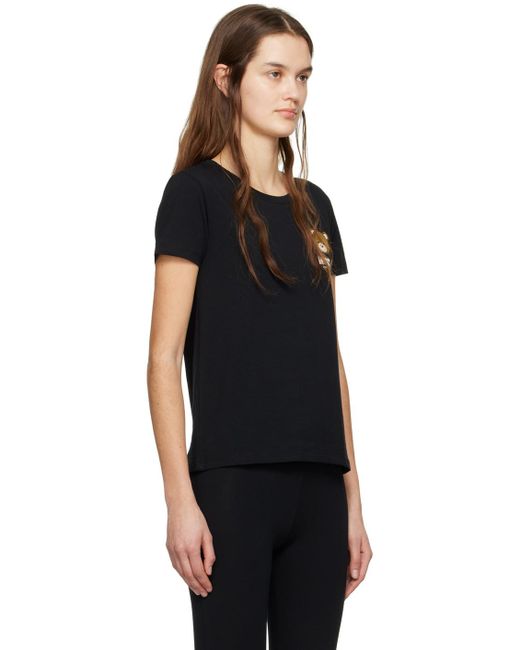 T-shirt noir à appliqués à logo Moschino en coloris Black
