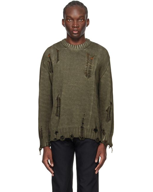 Green distressed shop sweater