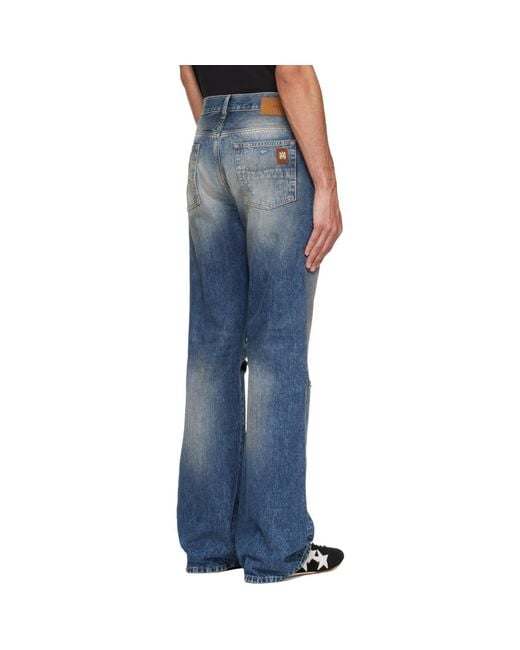Amiri Blue Slashed Bootcut Jeans for men