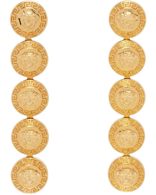 Boucles d'oreilles pendantes tribute dorées à méduses Versace en coloris Metallic