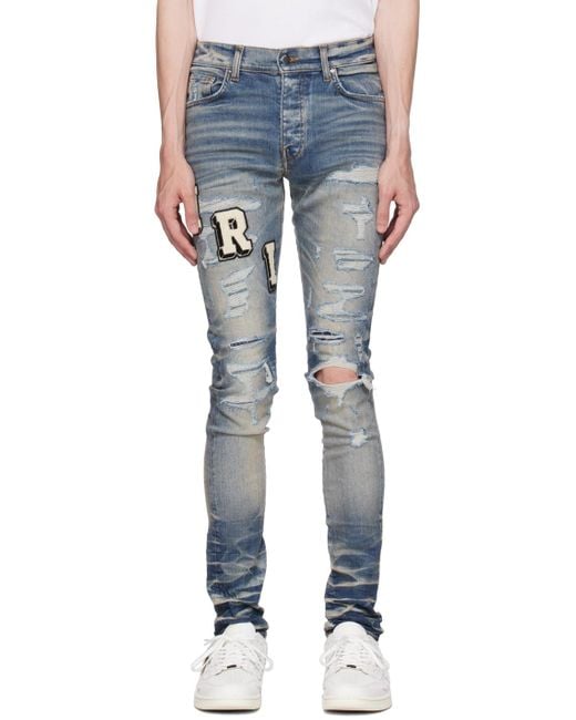 Amiri Blue Skinny-fit Logo-appliquéd Distressed Jeans for men