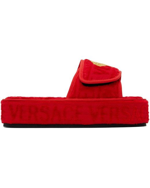 Pantoufles rouges à motif à logo Versace en coloris Red