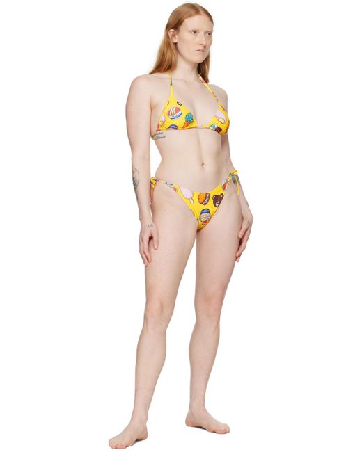 Haut de bikini jaune à motif graphique et images à logo imprimés Moschino en coloris Orange