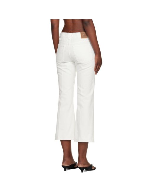 Totême White Kick Flare Jeans