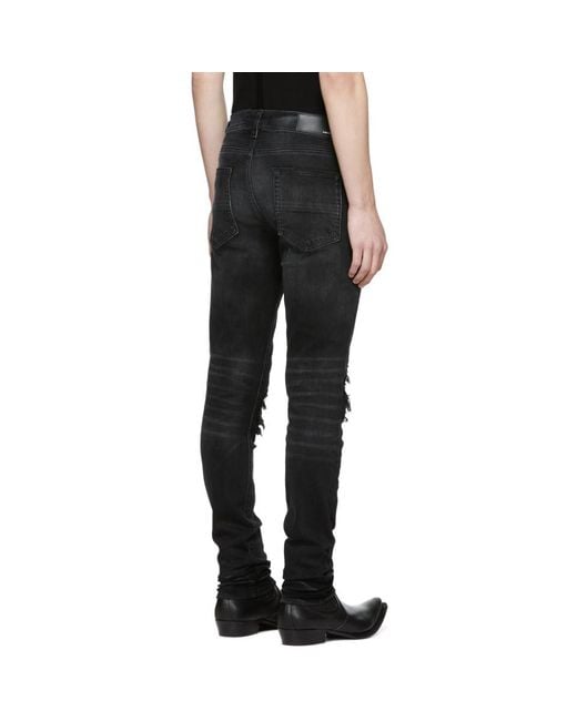 Amiri jeans sales leather patch