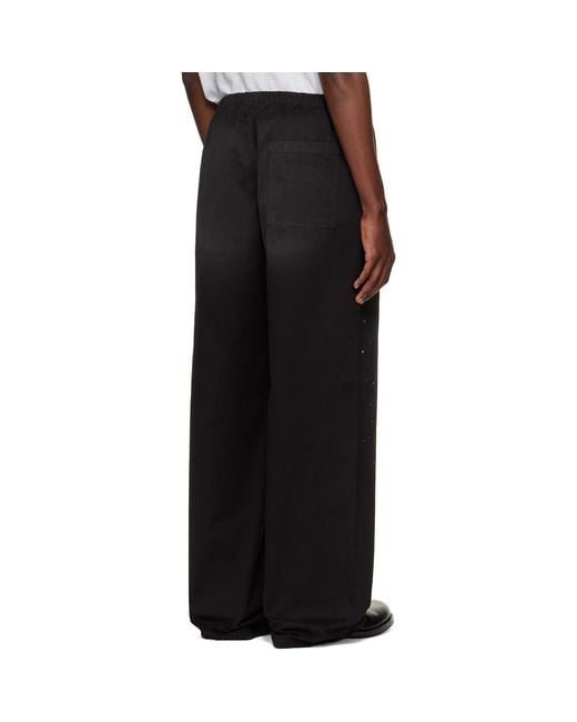 Acne Black Paint Splatter Drawstring Trousers for men