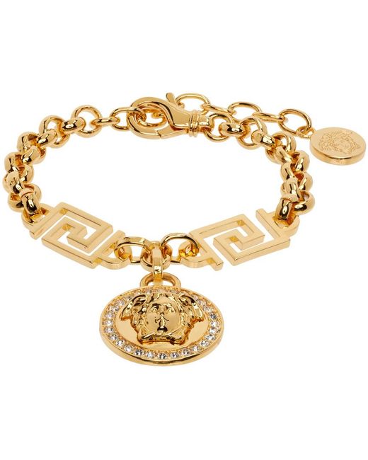 Bracelet doré à méduses et à ferrures à clé grecque Versace en coloris Metallic