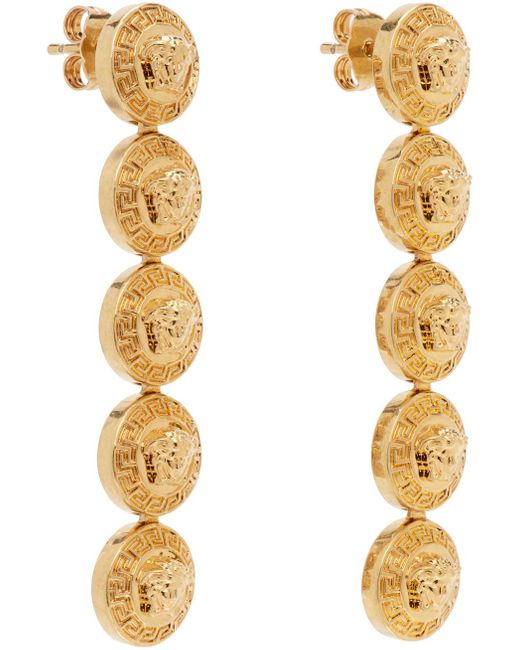 Boucles d'oreilles pendantes tribute dorées à méduses Versace en coloris Metallic