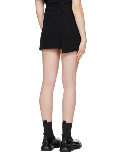 Mini-jupe portefeuille noire Ganni en coloris Black