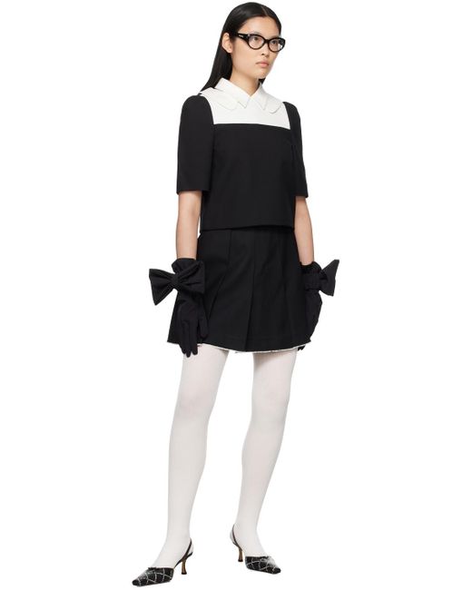 Mini-jupe noire à plis ShuShu/Tong en coloris Black