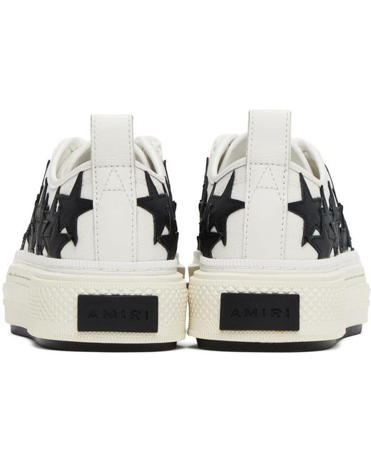 White sneakers with outlet black stars