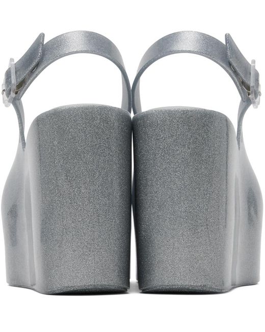 Chaussures à talon compensé groovy argentées Melissa en coloris Gray